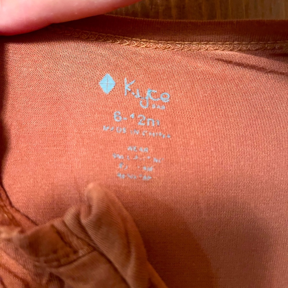 Rust colored kyte baby footless zippered one piece!